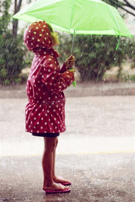 Little Girl Walking in the Rain Stock Photo - Image of leisure, hood ...