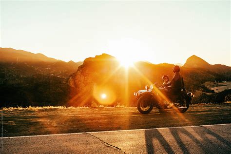 "Beautiful Young Couple Laughing Together At Sunset On Motorbike" by ...