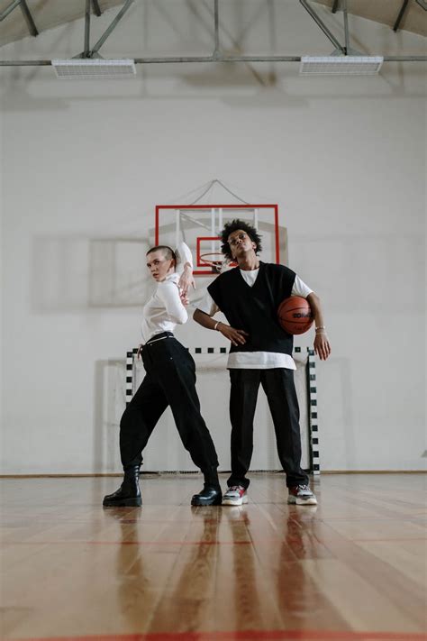 Two Teenagers on a Basketball Court · Free Stock Photo