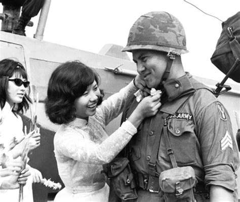 Vietnam War 1966 | Pretty Vietnamese girl pins a flower on u… | Flickr