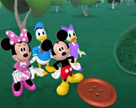 mickey mouse and friends are playing with a frisbee