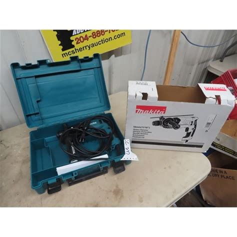 New Makita Rotary Hammer Drill w Case - McSherry Auction Service Ltd.