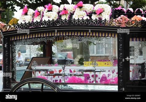 The coffin arrives at North East Surrey Crematorium, in Morden in Surrey for the funeral of ...