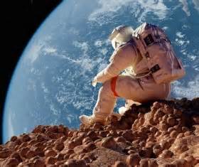 Floating astronauts fly to Earth Stock Photo free download