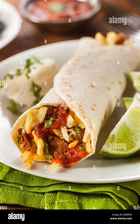 Hearty Chorizo Breakfast Burrito with Eggs, Cheese, and Hashbrowns Stock Photo - Alamy