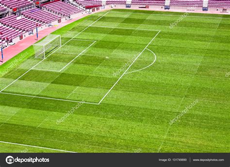 Football stadium with green grass — Stock Photo © IrinaPups #131749890