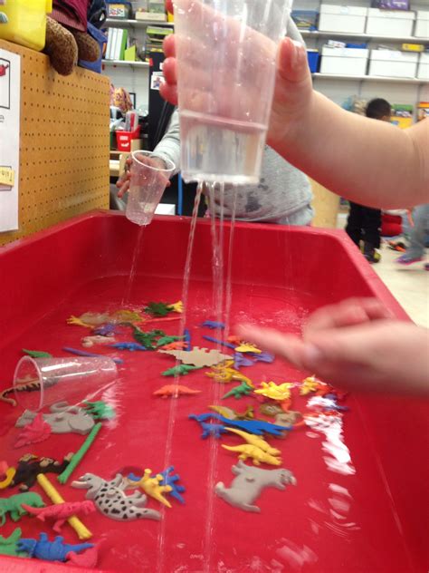 "It's Raining" station for the sensory table in pre-kindergarten. Add colored animals or dinos ...