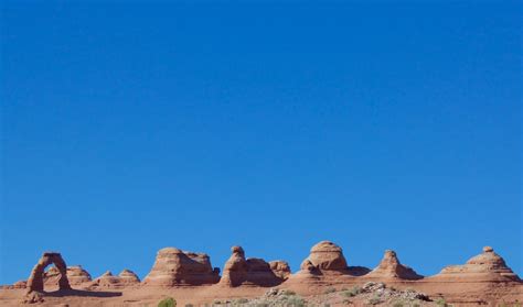 Brown rock formation under blue sky during daytime photo – Free Blue Image on Unsplash
