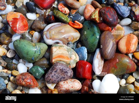 Colorful sea pebbles on the shore Stock Photo - Alamy