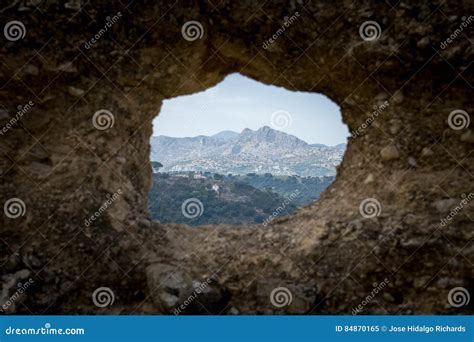 A View through a Hole in the Wall Stock Image - Image of garden, fullframe: 84870165