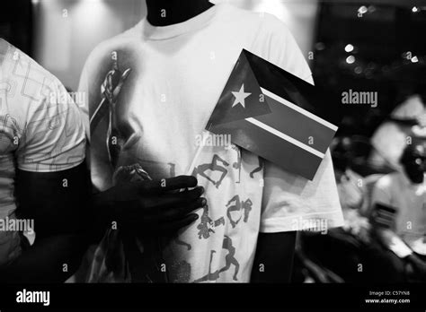 South Sudanese man holds the flag of Republic of South Sudan during independence celebrations ...