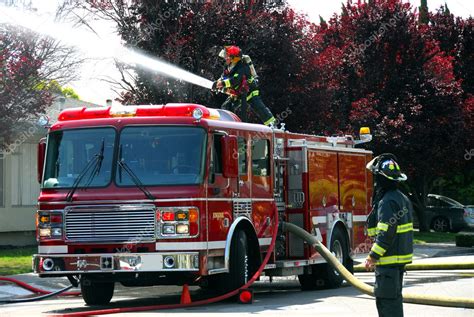 Firemen and fire truck at an apartment fire – Stock Editorial Photo ...