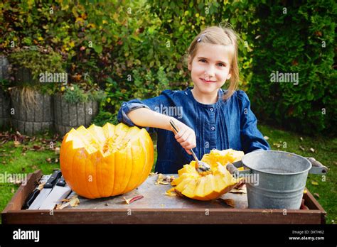 Girl carving Jack O'Lantern Stock Photo - Alamy