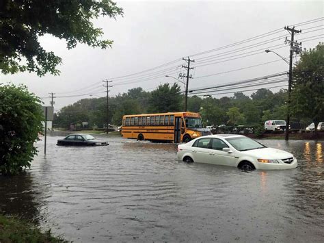 Cities, town urging residents to stay off flooded roadways - Connecticut Post