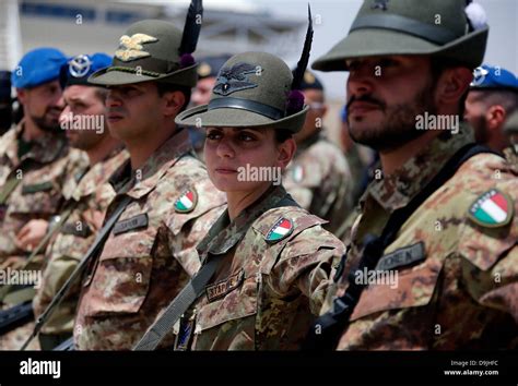 Italian armed force soldiers of the mountain unit Alpini stand in line ...