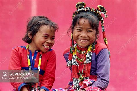 Portrait of two smiling children of the Kalagan tribe famous for Eric an ethnic dance of joy and ...