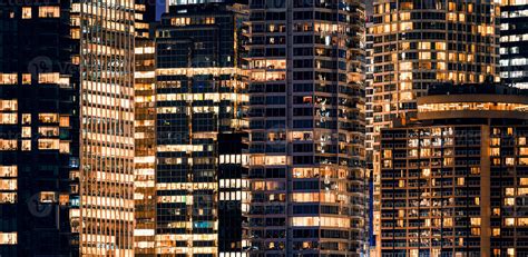 Facade windows of illuminated modern skyscraper with office building at night 2911667 Stock ...