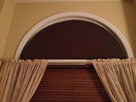 Home made arch window covering to stop the sun from coming into the bedroom in the morning but ...