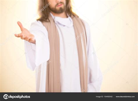 Jesus reaching out his hand Stock Photo by ©photographee.eu 154492042