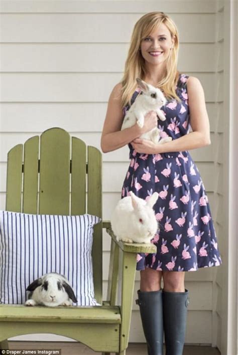 Reese Witherspoon cuddles up with bunny to model new dress | Daily Mail Online