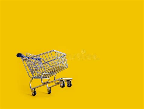 Empty Shopping Cart Over Yellow Background Stock Photo - Image of groceries, marketing: 170403940