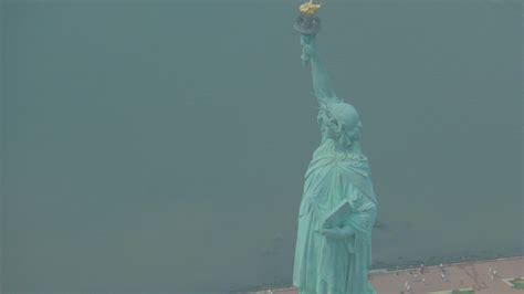 1992 - Helicopter aerial of the Statue of Liberty in New York City ...