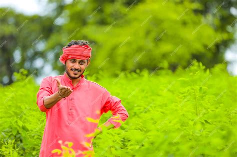 Premium Photo | Young indian farmer in traditional clothing on the field