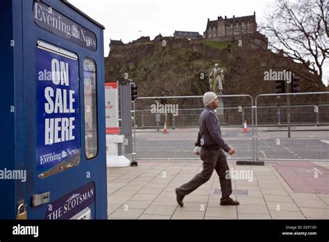 Vendor selling The Scotsman and Edinburgh Evening News newspapers from ...