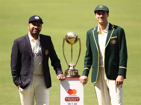 Captains Rohit Sharma and Pat Cummins pose with the Border-Gavaskar ...