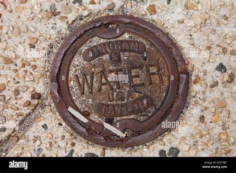 Bingham & Taylor cast iron water valve box (curb box) on public walkway - USA Stock Photo - Alamy