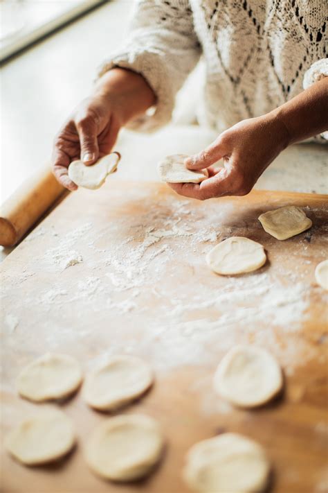 Person Holding Dough on her hands · Free Stock Photo