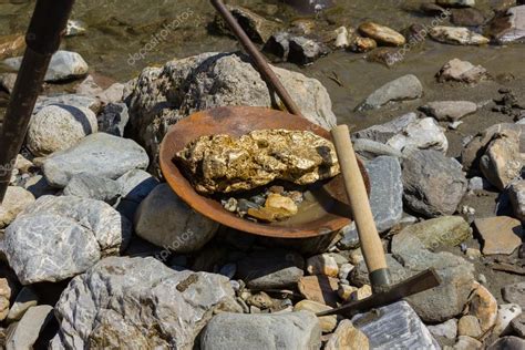 Gold Nugget mining from the River — Stock Photo © Luftklick #113218026