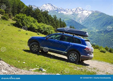 Car in Mountains. Car is an Off-road Car in Mountain on Clear, Sunny Summer Day Stock Image ...