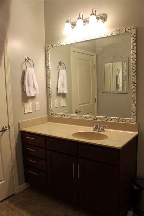 Framing A Bathroom Mirror With Glass Tile – Everything Bathroom