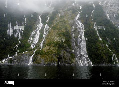 Hundreds of waterfalls flowing from the mountains during the rainstorm in Fiordland National ...