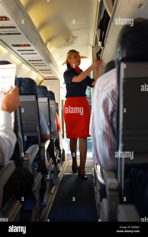 airline cabin crew prepares for take off Stock Photo - Alamy