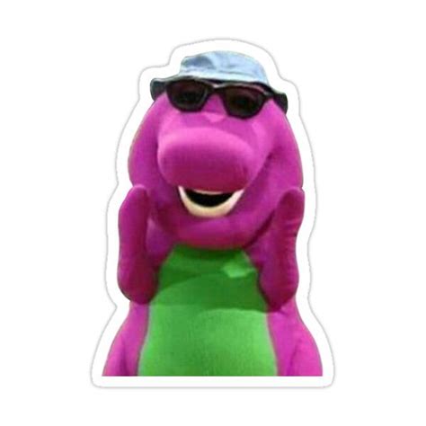 a purple stuffed animal with sunglasses on it's head