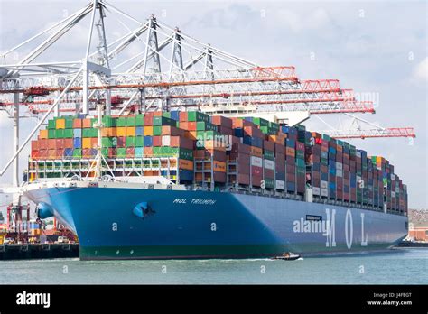 MOL Triumph container ship at DP World container port in Southampton Docks. MOL Triumph is one ...