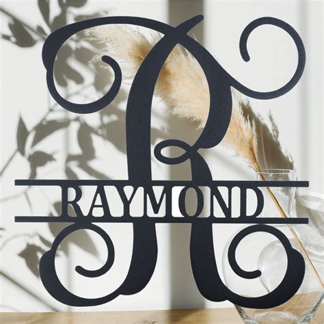 Unique monogram is the focal point of this steel plaque. Put your family's last name initial ...