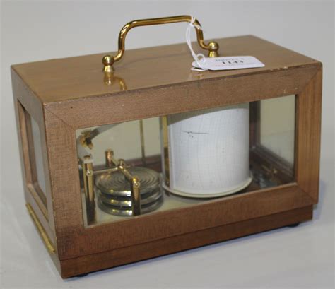 A 20th Century French barograph with lacquered brass mechanism and clockwork recording drum, inscrib