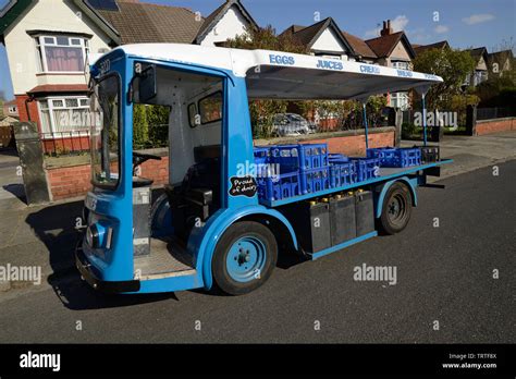 An original milk float still in use in Wirral England UK Stock Photo ...