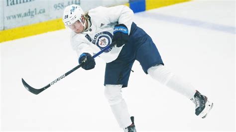 Jets' star Patrik Laine listed day-to-day with upper-body injury | CBC ...