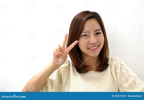 Smiling Young Woman Two Finger Peace Sign Hand Gesture Stock Photo - Image: 29319140