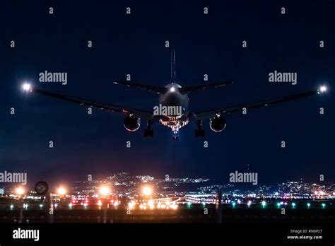 Plane night landing hi-res stock photography and images - Alamy