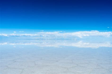 Uyuni Salt Flats. Altiplano, Bolivia. Rainy Season. Tunupa Volcano. Clouds Reflection on Water ...