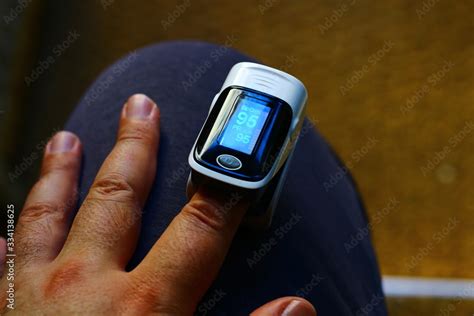 Pulse oximeter measuring oxygen saturation in blood and heart rate ...