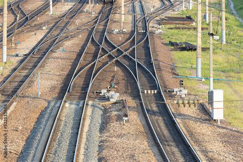 A railway junction with crossing parallel railroad tracks. Perspective ...