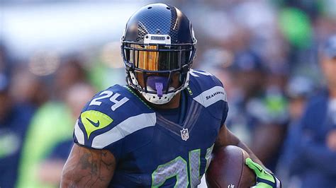 Marshawn Lynch With Closed Blue Helmet Wearing Blue Sports HD Seattle ...