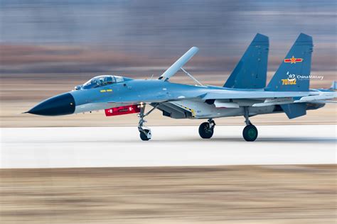 J-11B fighter jet flies past the sun- China.org.cn