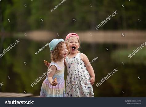 Two Little Girl On Lake Pier Stock Photo 1234610353 | Shutterstock